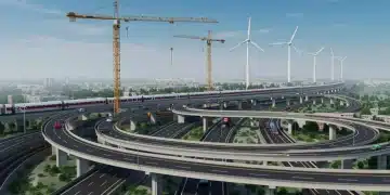 Modern infrastructure projects under construction with cranes, highways, and renewable energy